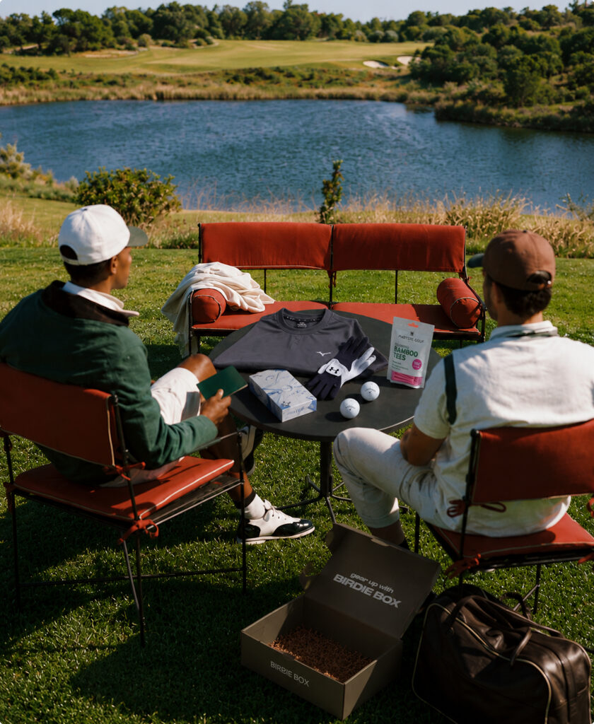 Golfer holding an open Birdie Box